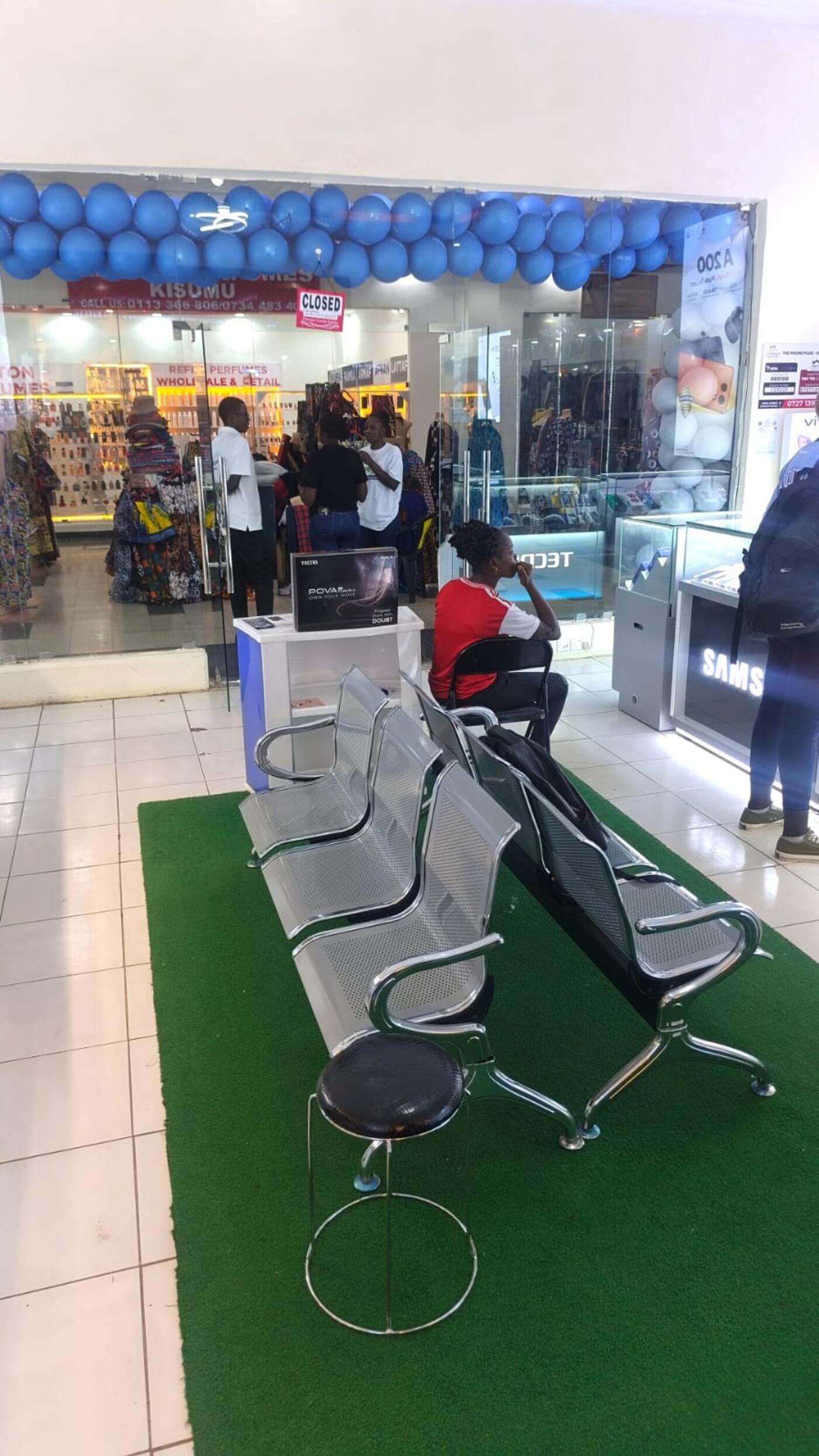 The Phone Plug Kisumu shopfront viewed from the Kisumu Mega City walkway