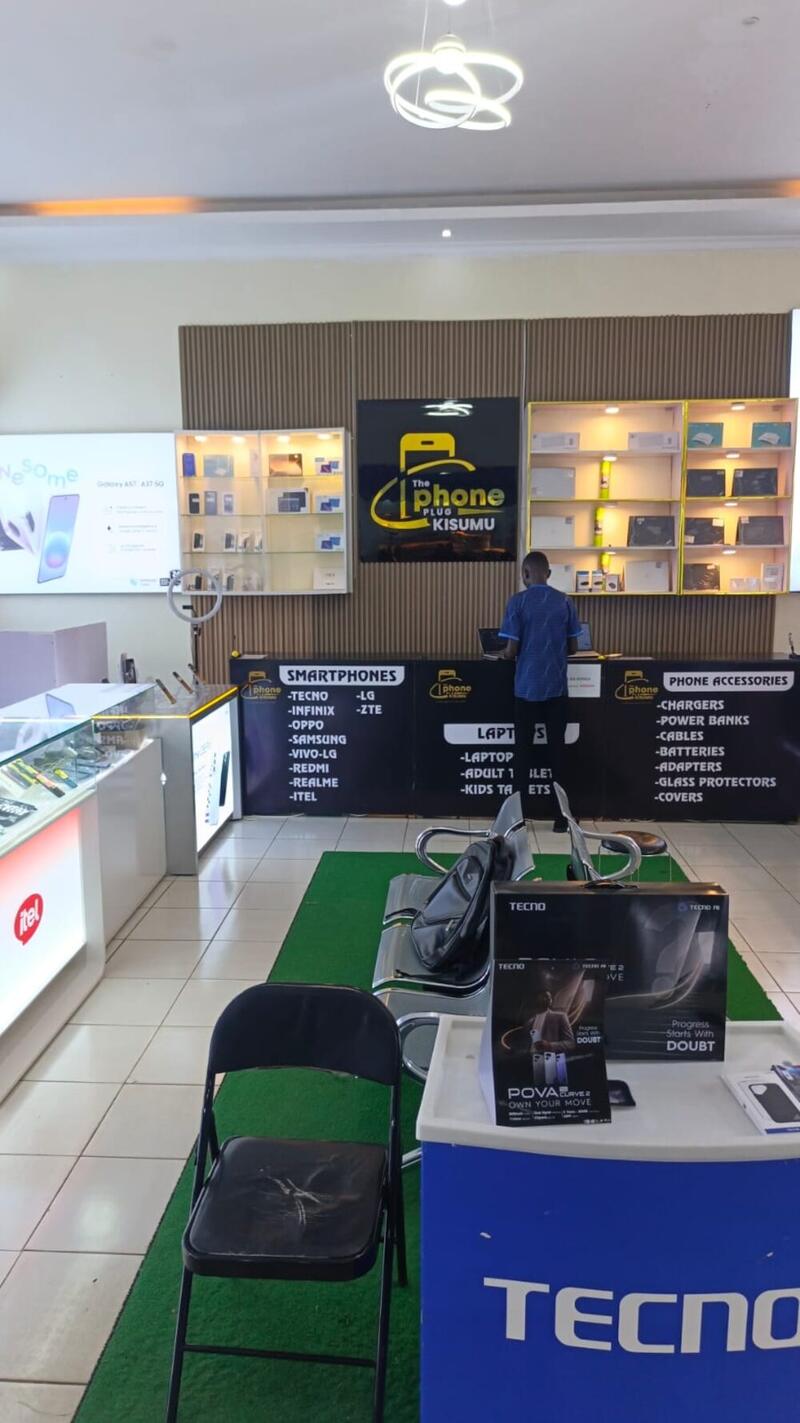 Staff member assisting a customer at the accessories counter