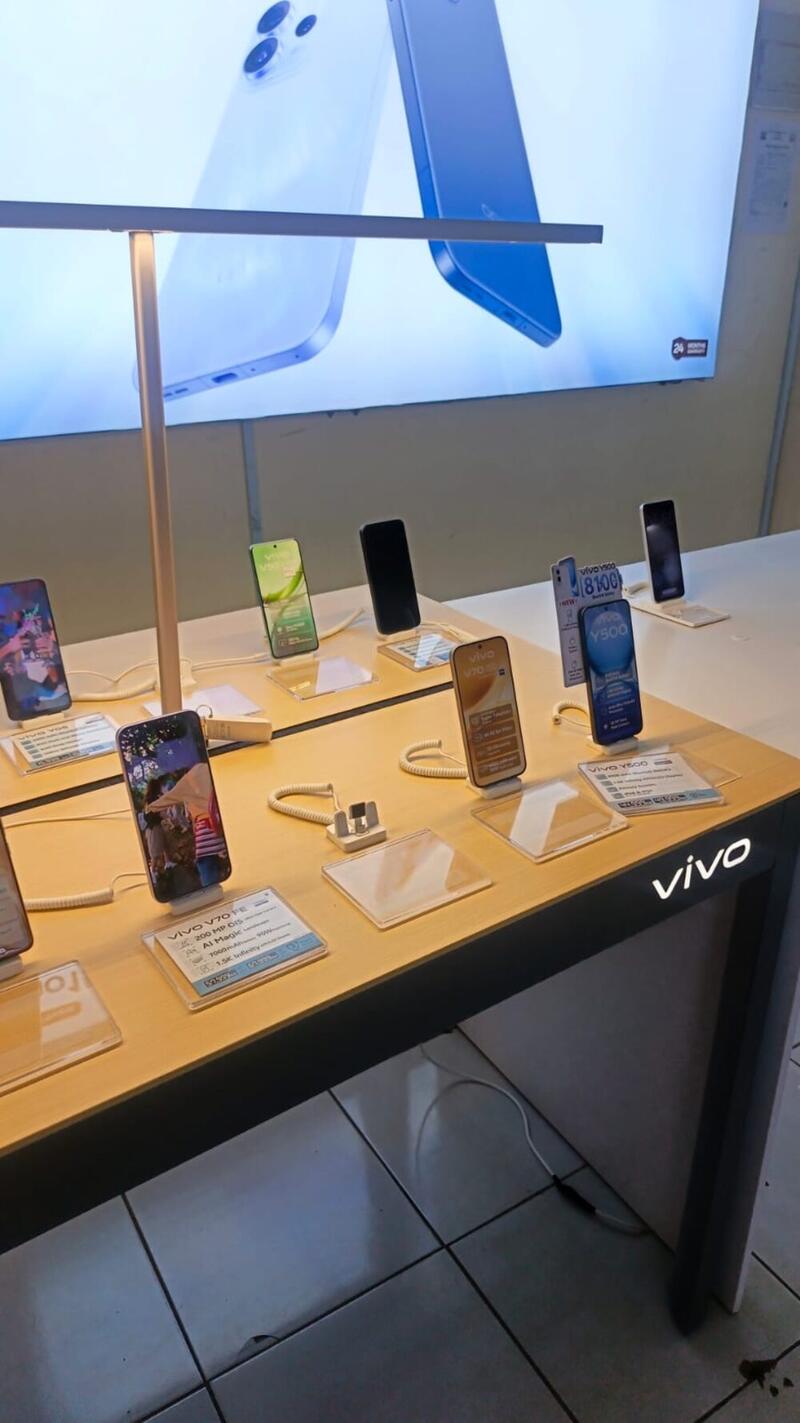 Vivo smartphone display with accessories wall behind